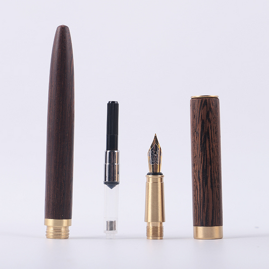 Brass, wooden, and iridium-plated gold pen with ink sac