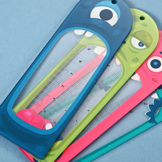 Cartoon-style, transparent ruler with alien design