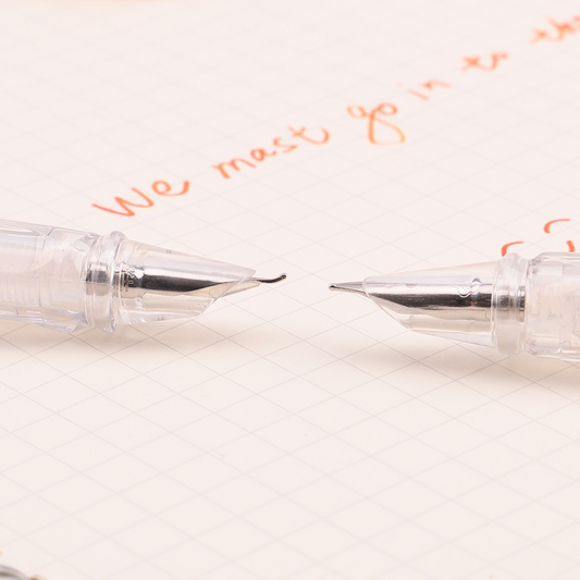 Transparent piston, artistically designed, with a pointed tip and made of steel.