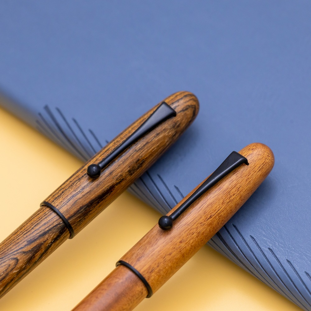 Wooden, black pen holder with threaded mechanism for rotating the pen
