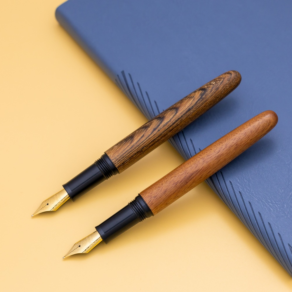 Wooden, black pen holder with threaded mechanism for rotating the pen