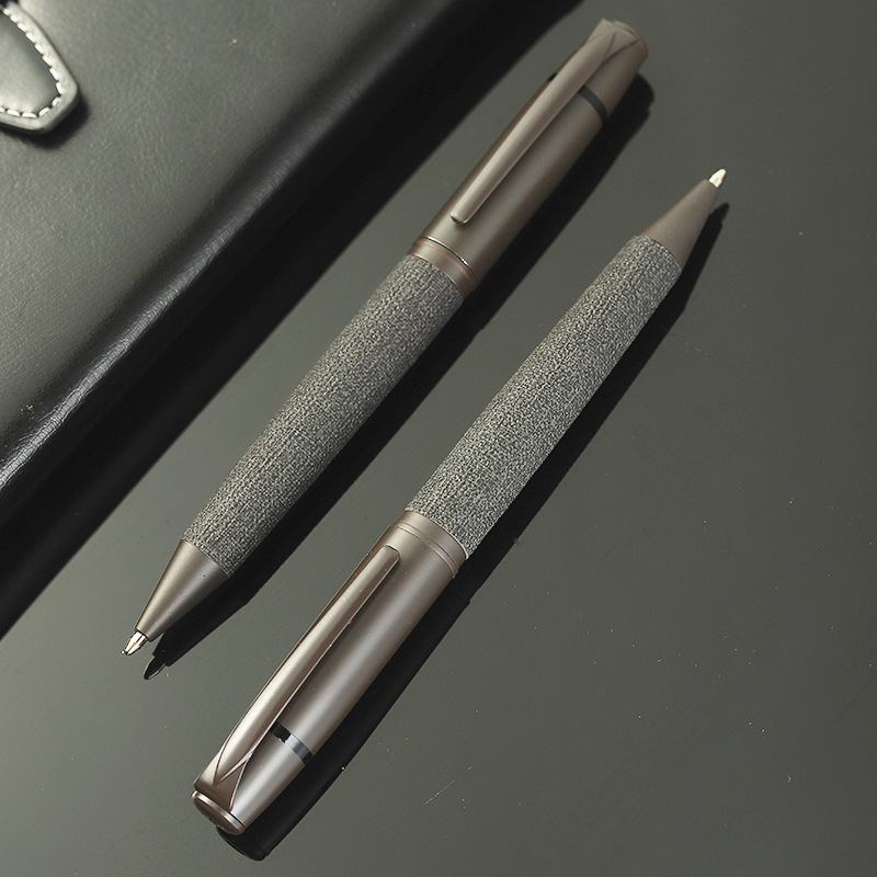 Metal, oil-based ballpoint pen with a rotary bullet tip for office use