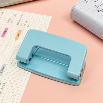 Macaron double hole puncher, manual hole puncher for student stationery, office binder, journal puncher, circular hole puncher.